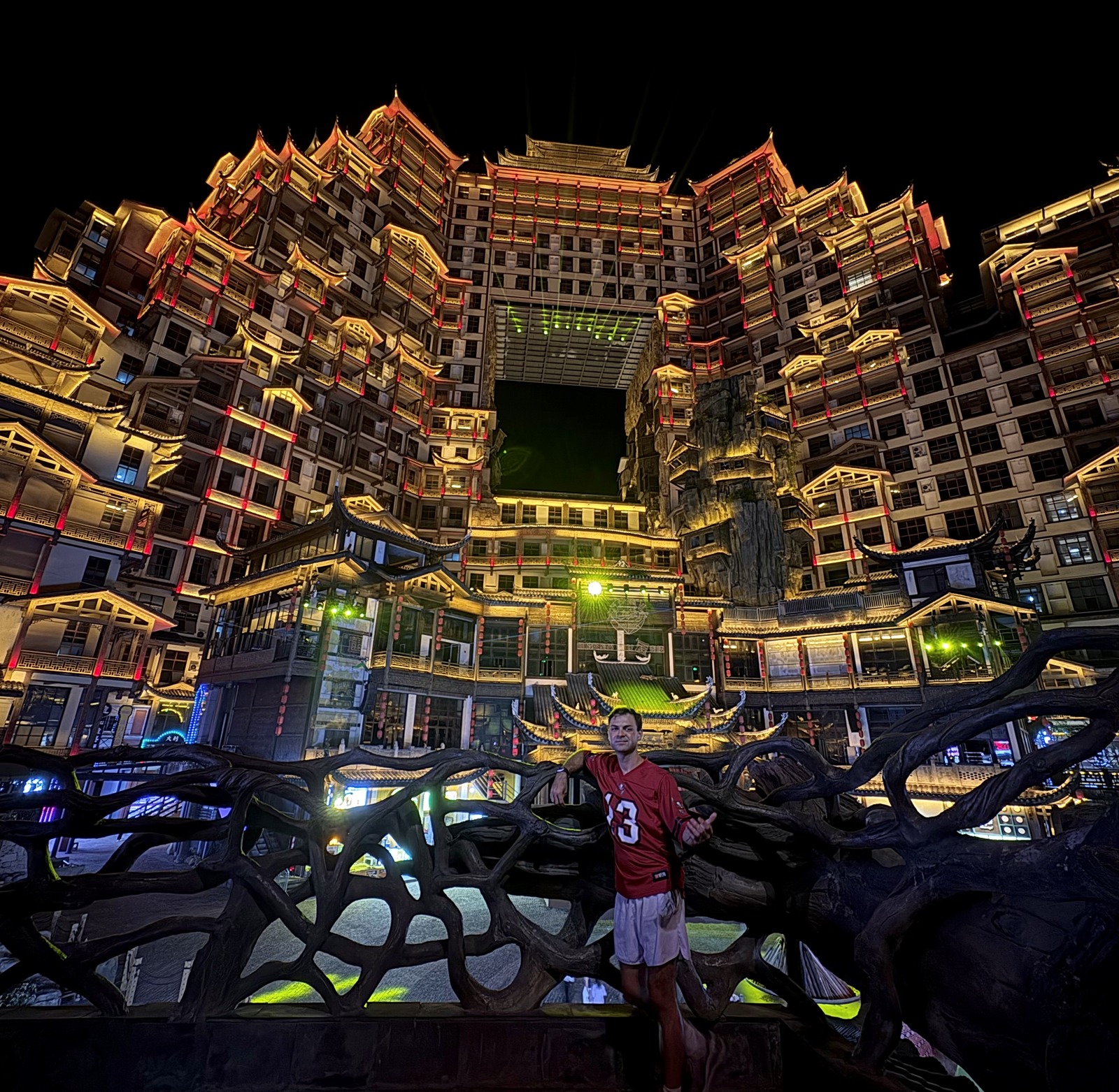 An illuminated building complex in a Chinese city at night